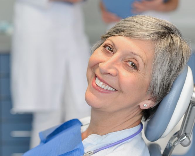 An older female patient in a dental chair